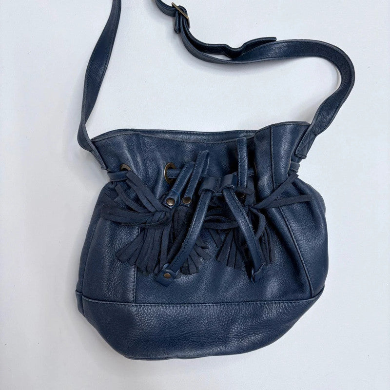 navy blue tassle bucket bag