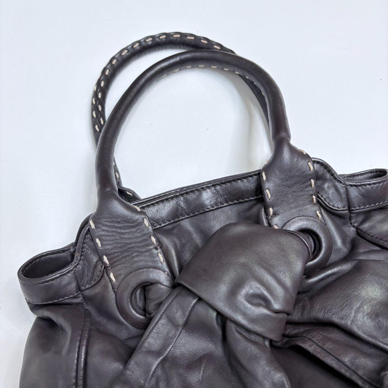 Brown leather bow bag