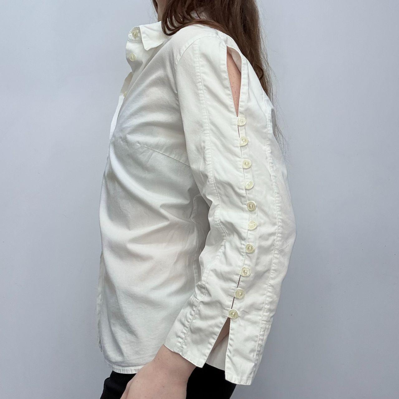 White flared button up shirt