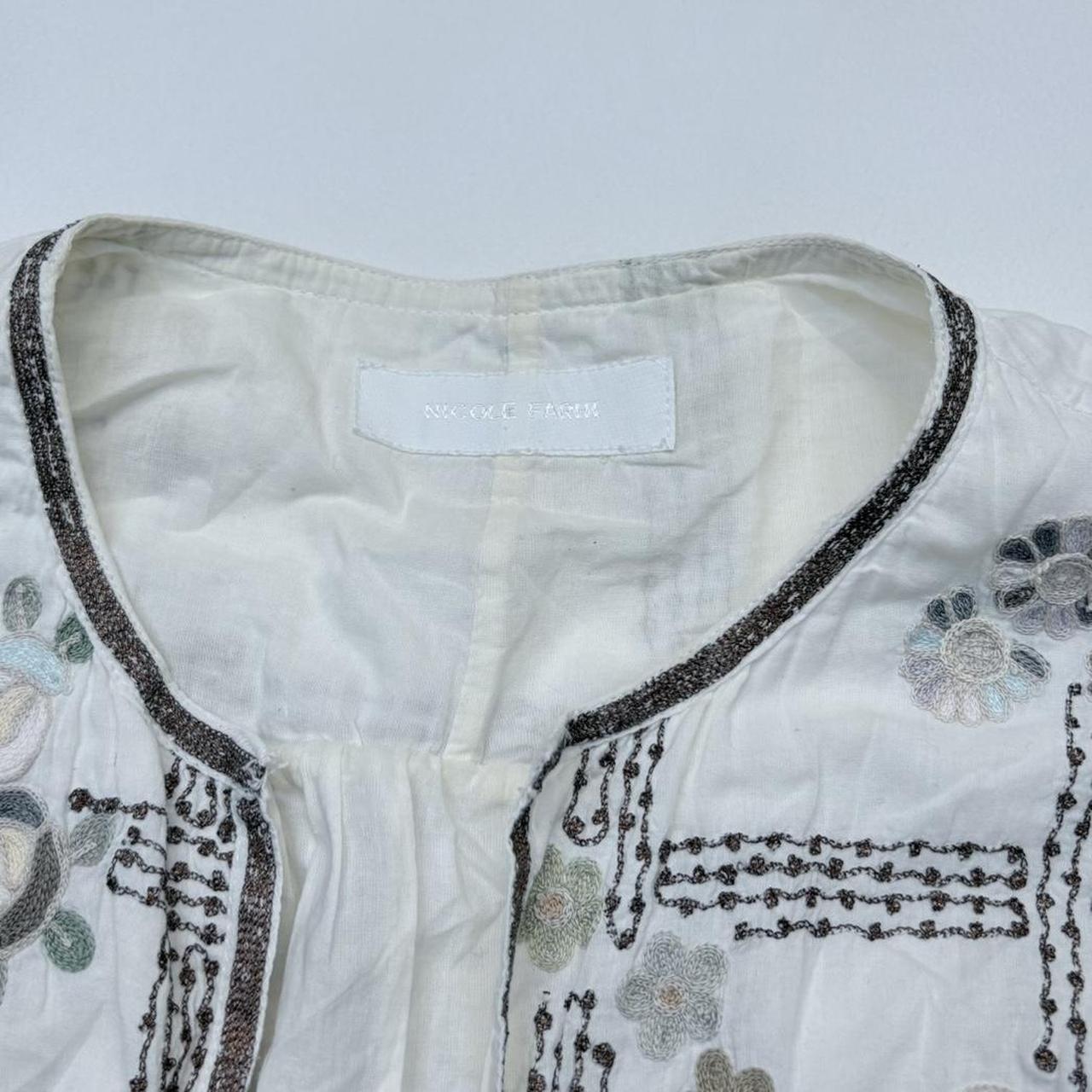 White embroidered flared puff sleeve shirt