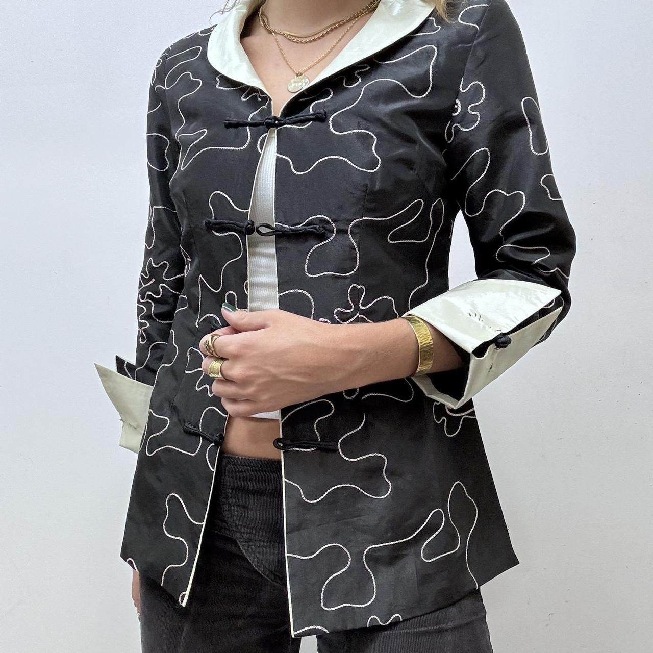 Flared emboidered silk jacket