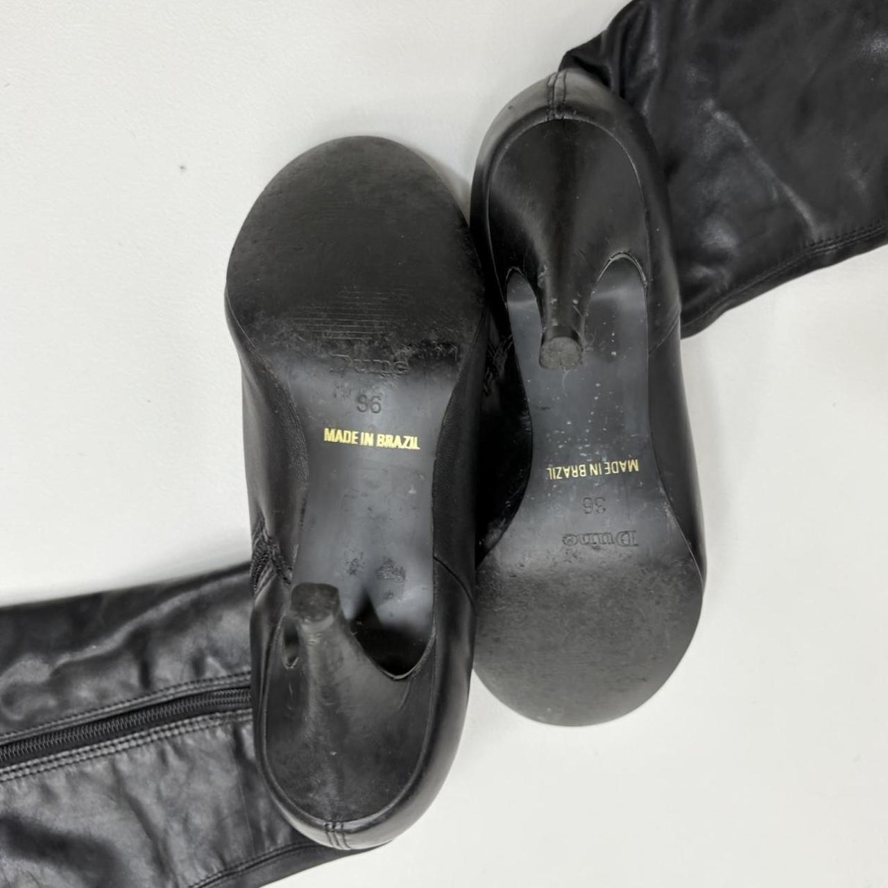 Black pointed toe heel boots