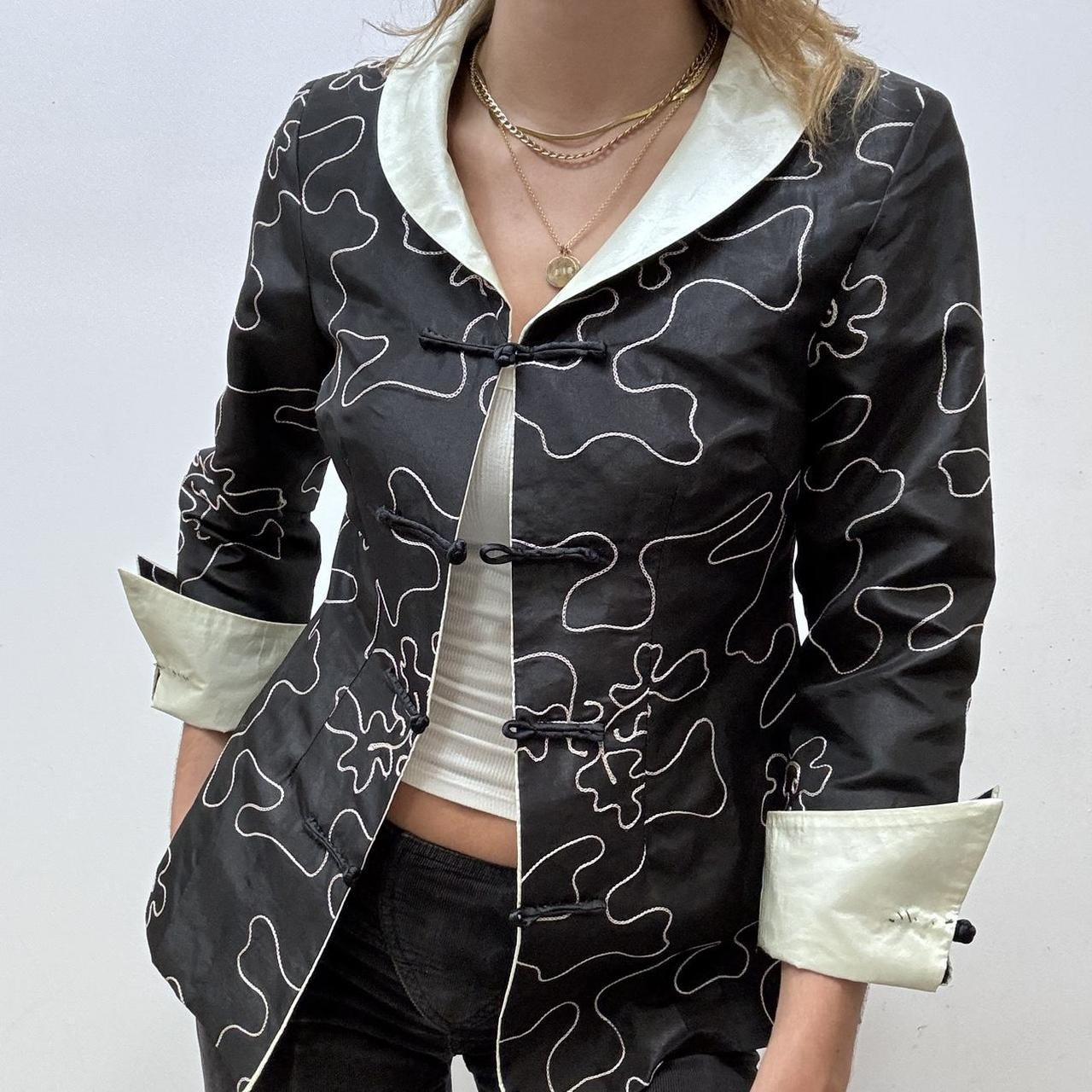 Flared emboidered silk jacket