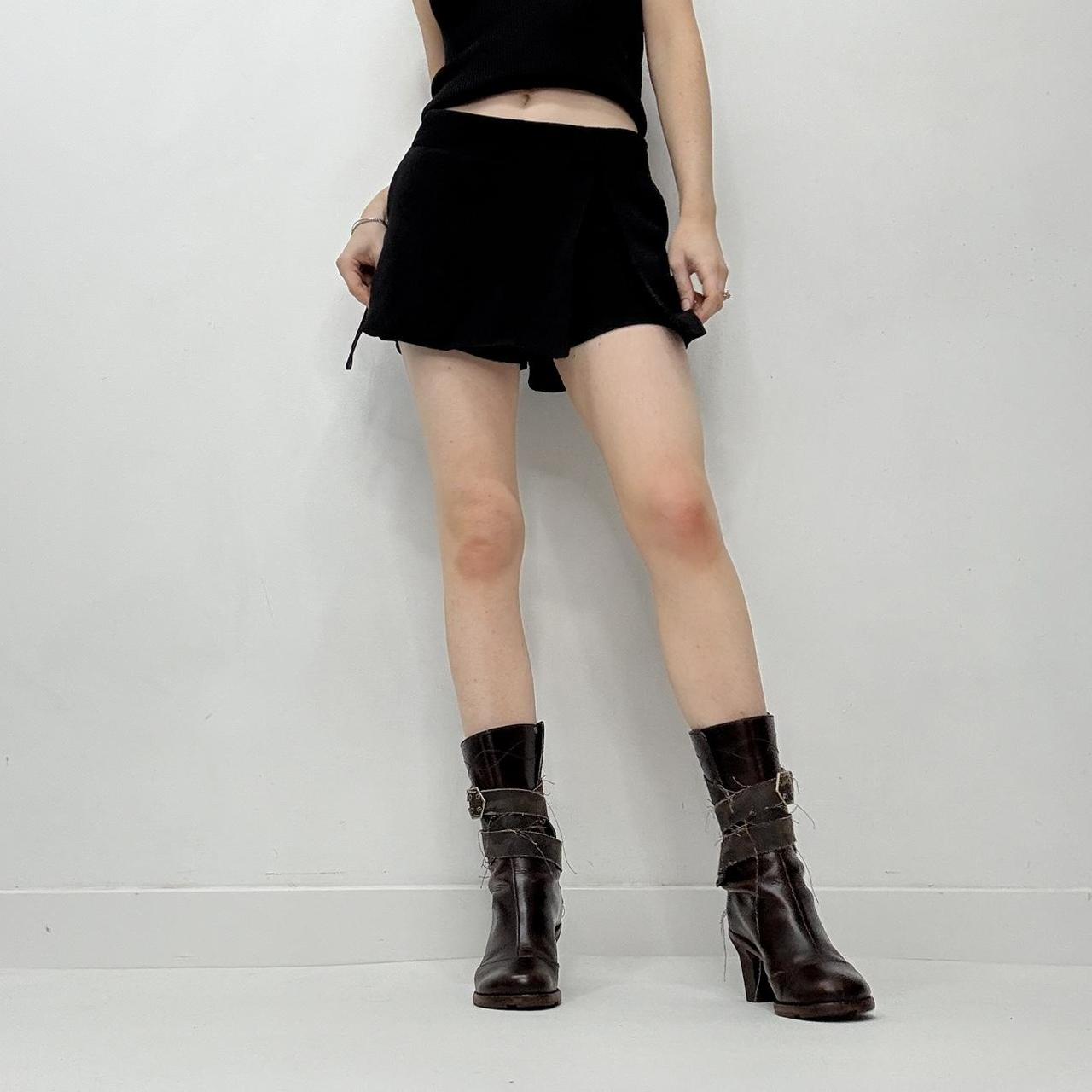 Black asymmetrical slit pleat mini skort