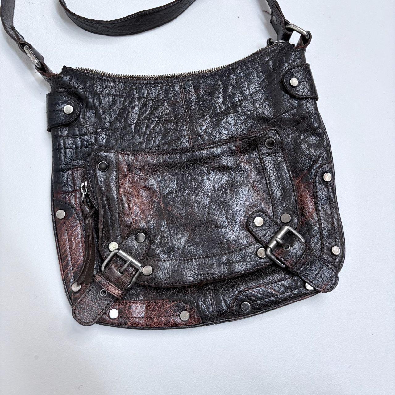 Distressed brown leather buckle studded bag