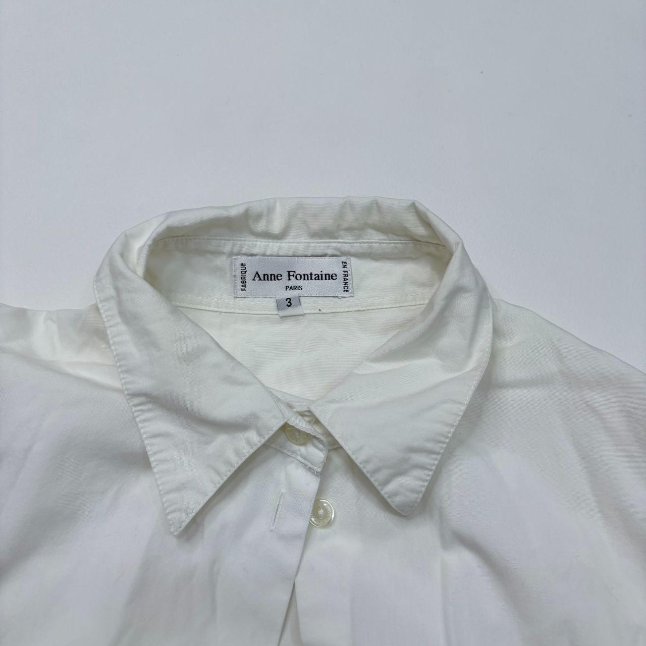 White flared button up shirt