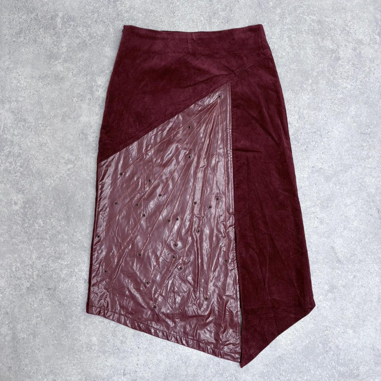 Red leather eyelet studded asymmetric skirt
