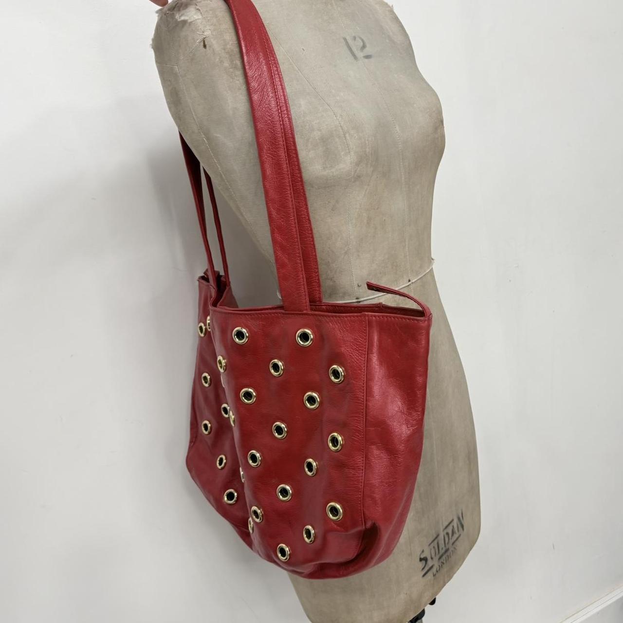 Red leather studded eyelet bag
