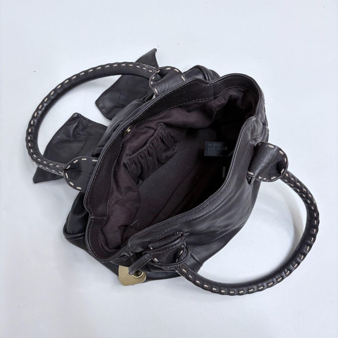 Brown leather bow bag