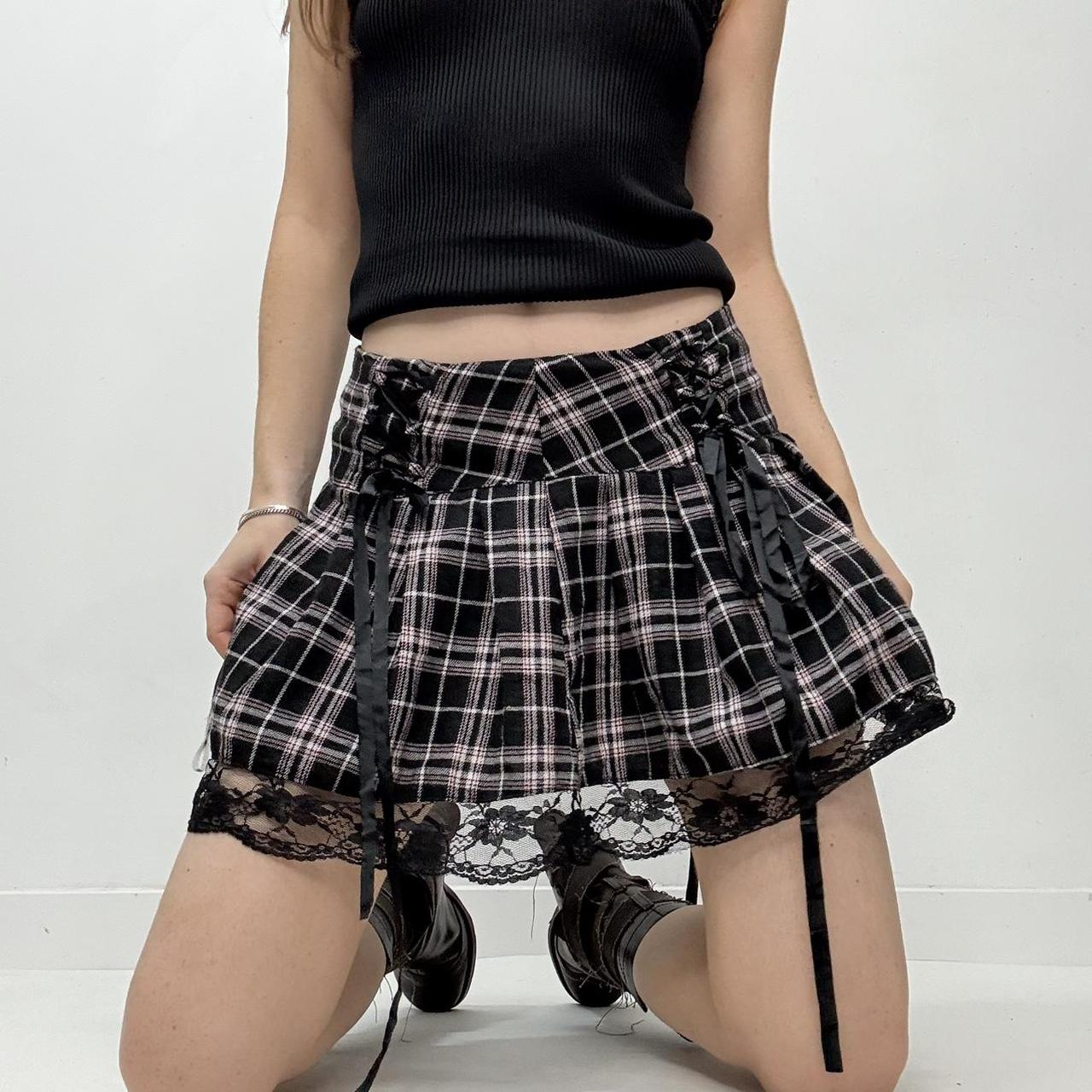 Black pleated mini tartan skirt