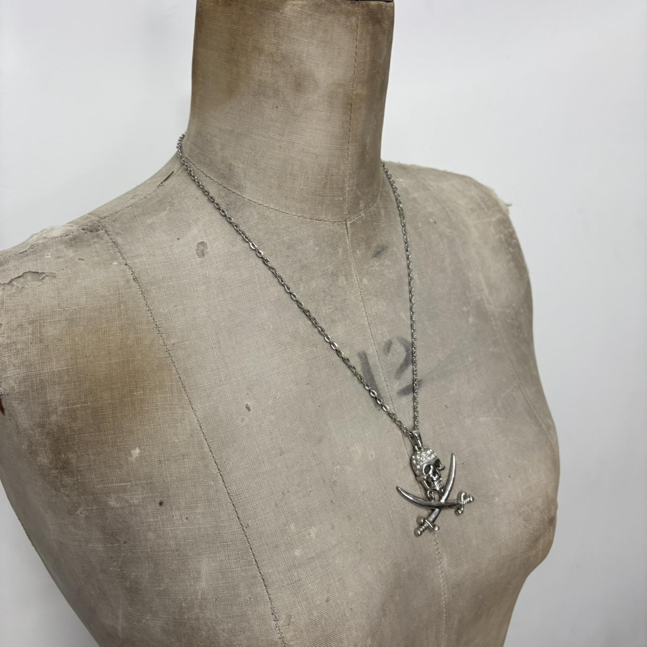 Silver skull and cross bone necklace