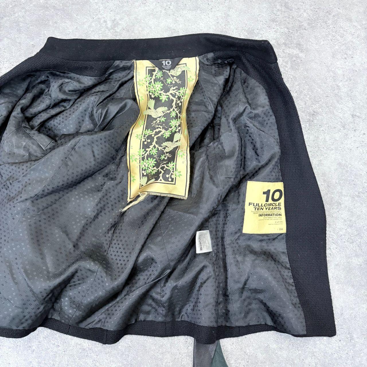 Black asymmetric flared draped jacket