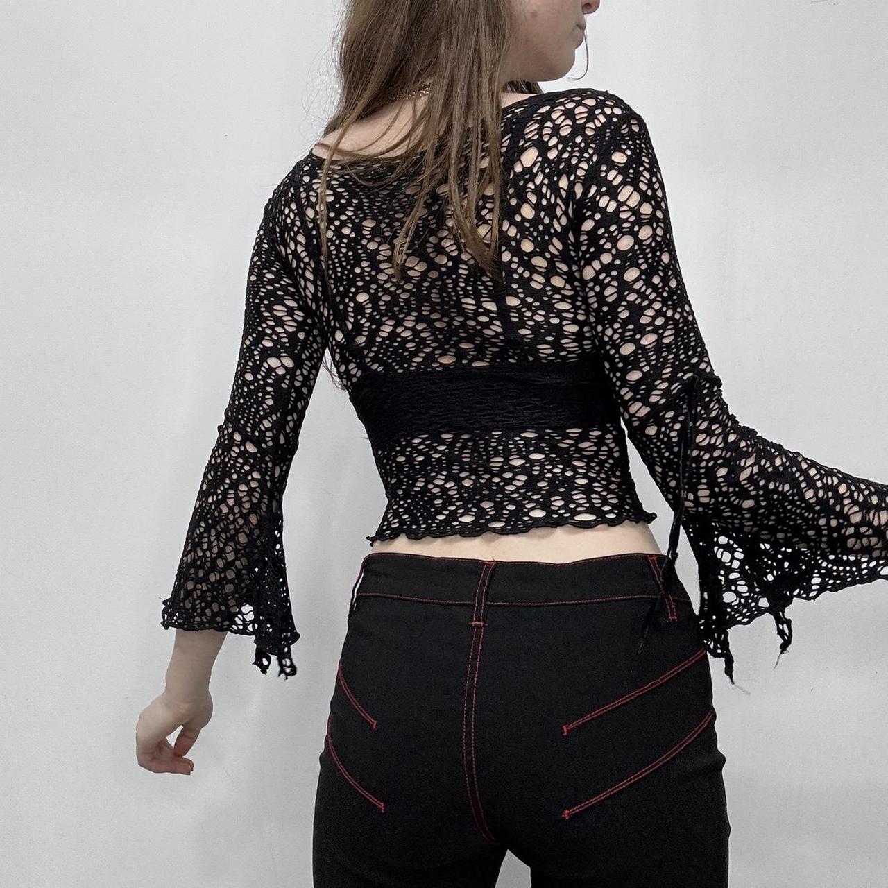 Sheer black open knit flared top