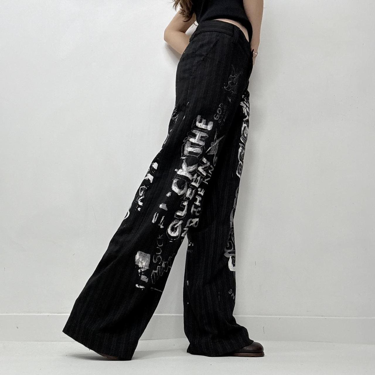 Black pinstripe graphic text trousers