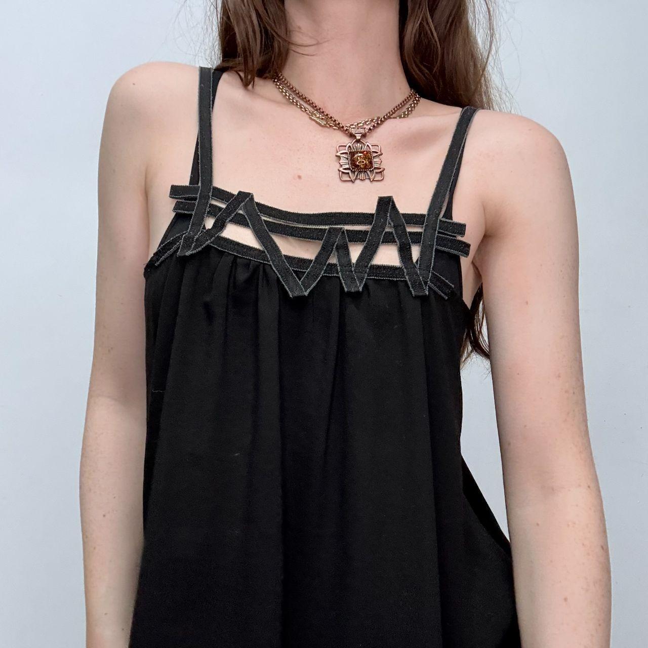 Black asymmetric flared Cop Copine vest