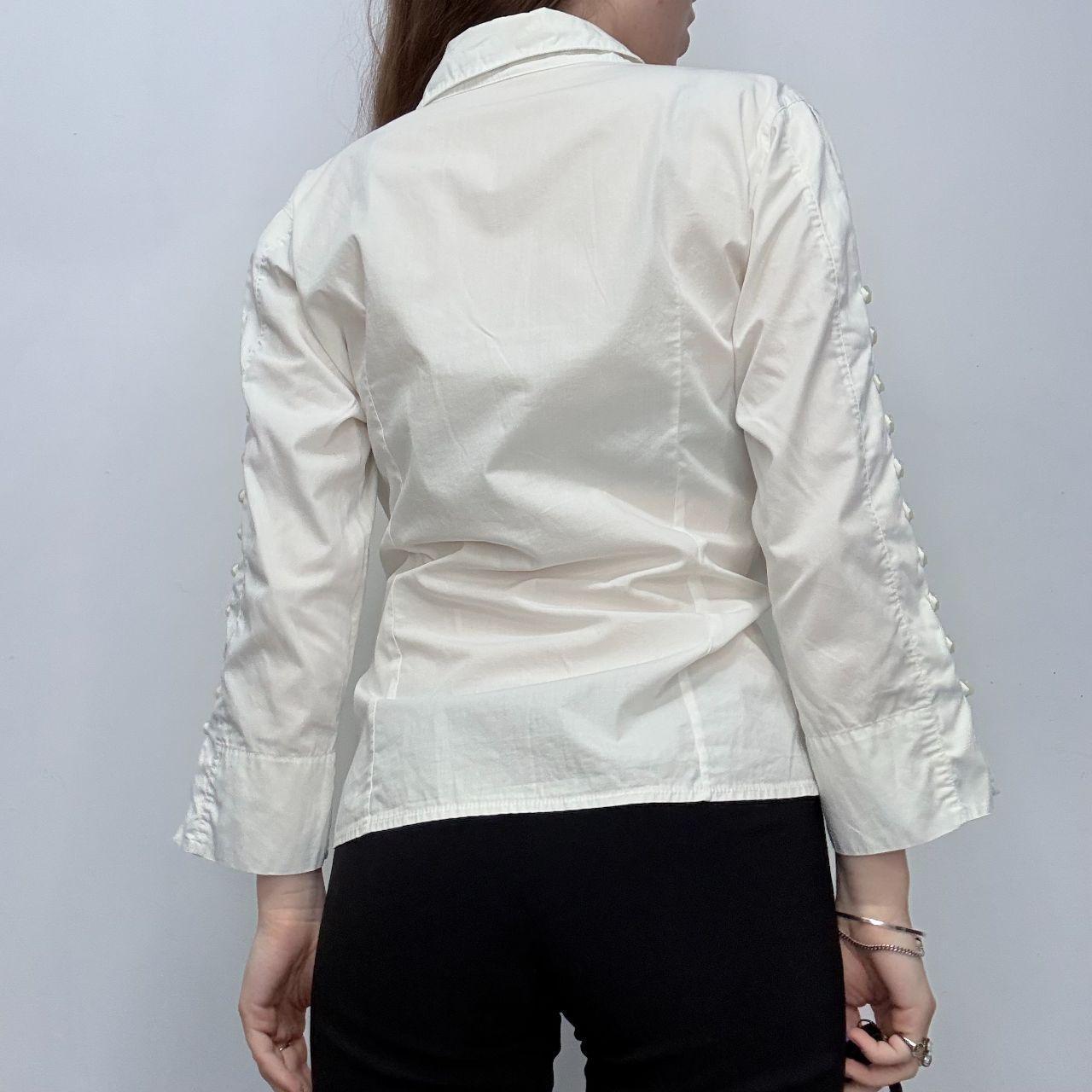 White flared button up shirt