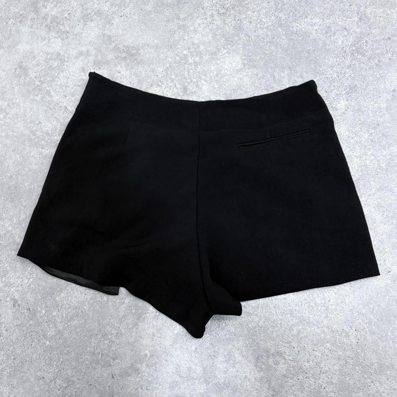 Black asymmetrical slit pleat mini skort