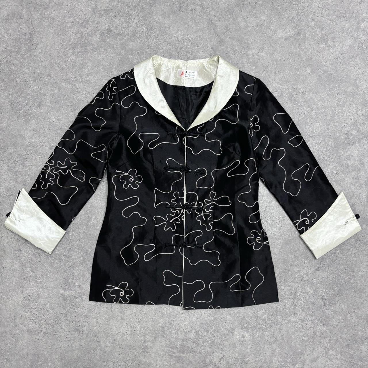 Flared emboidered silk jacket