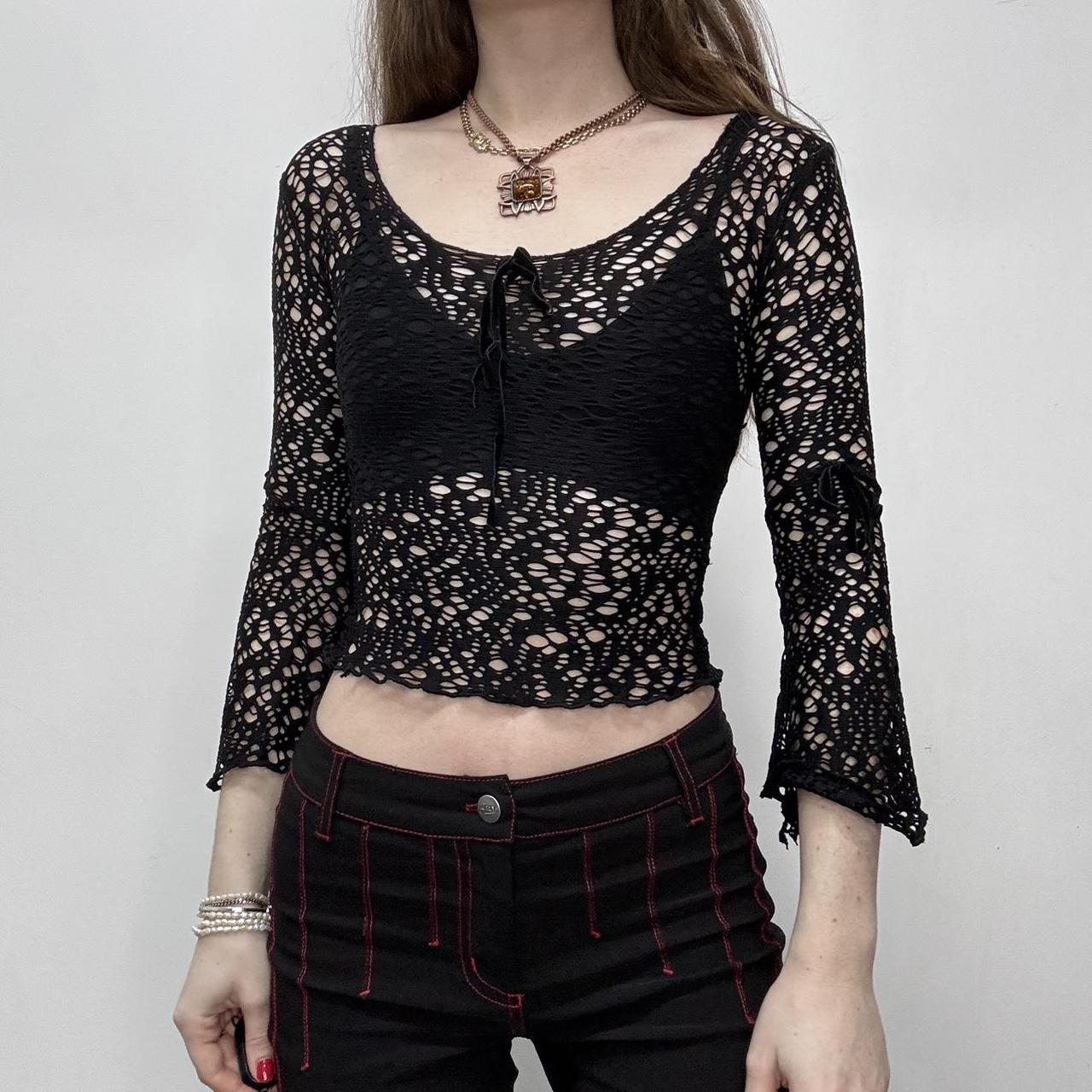Sheer black open knit flared top