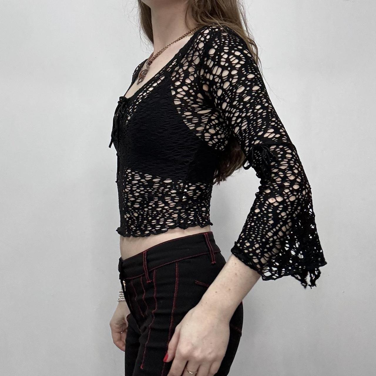 Sheer black open knit flared top