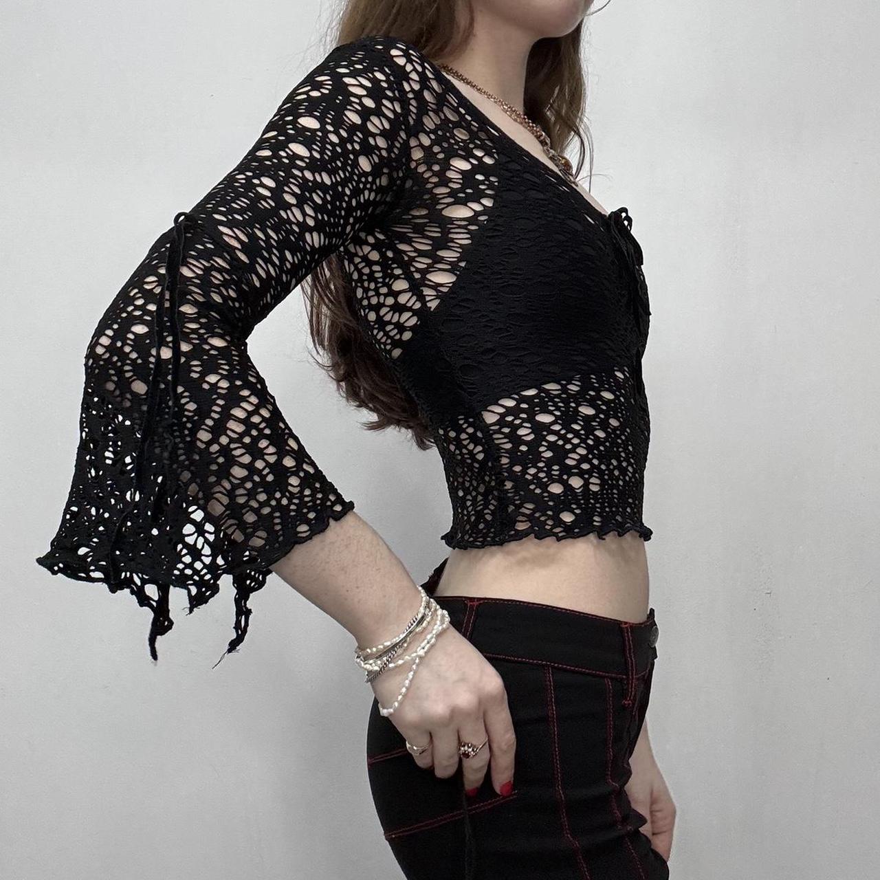 Sheer black open knit flared top