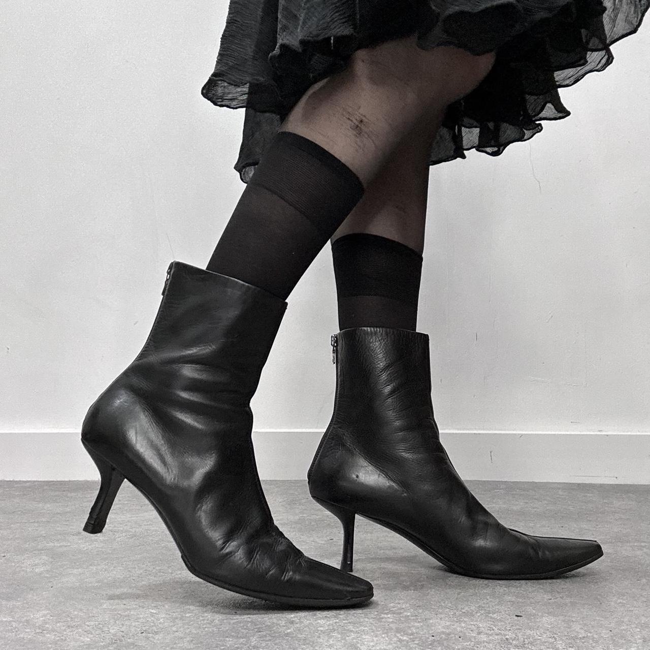Black pointed heel Prada boots