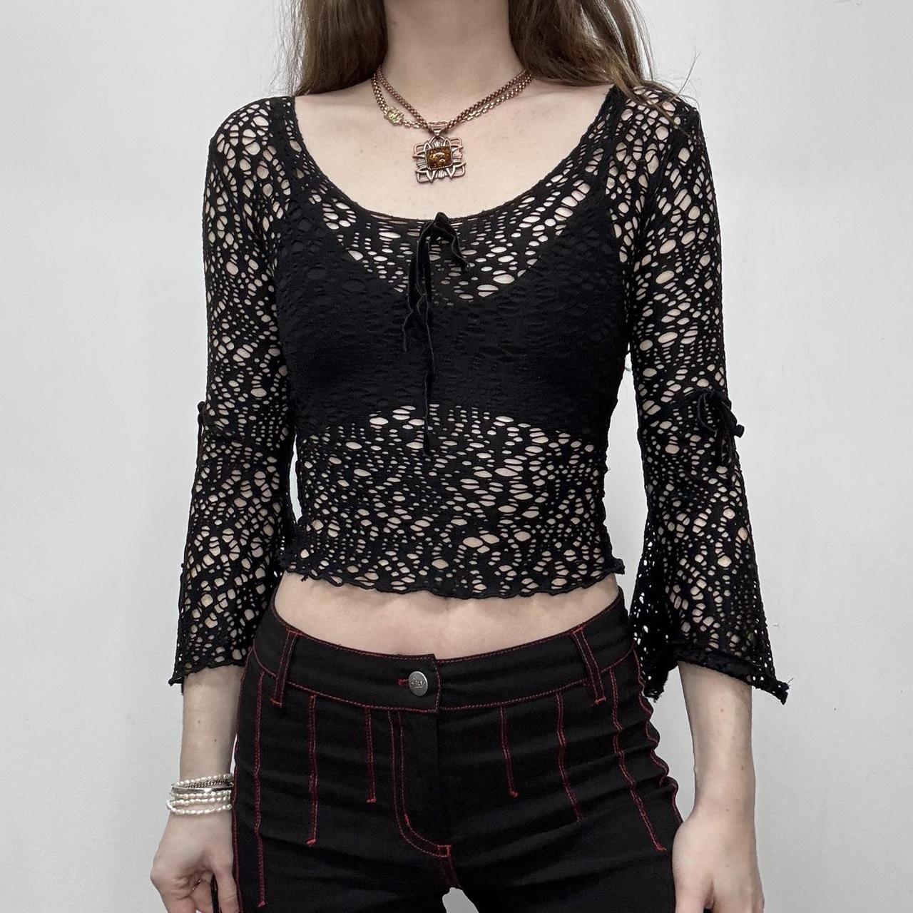 Sheer black open knit flared top
