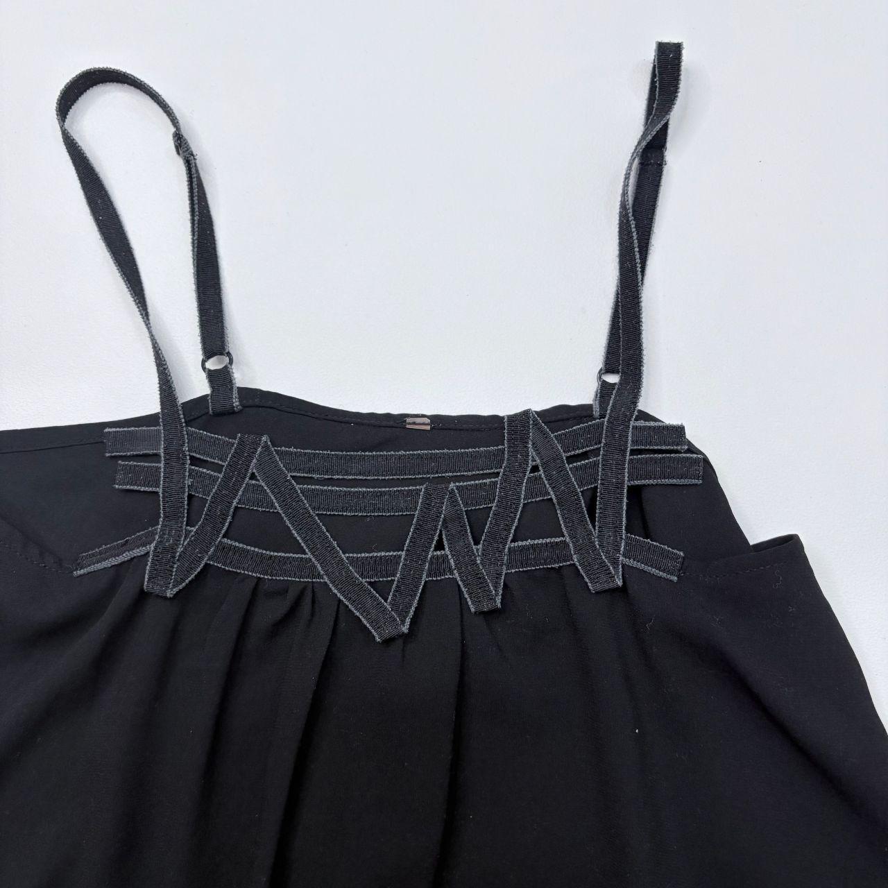 Black asymmetric flared Cop Copine vest
