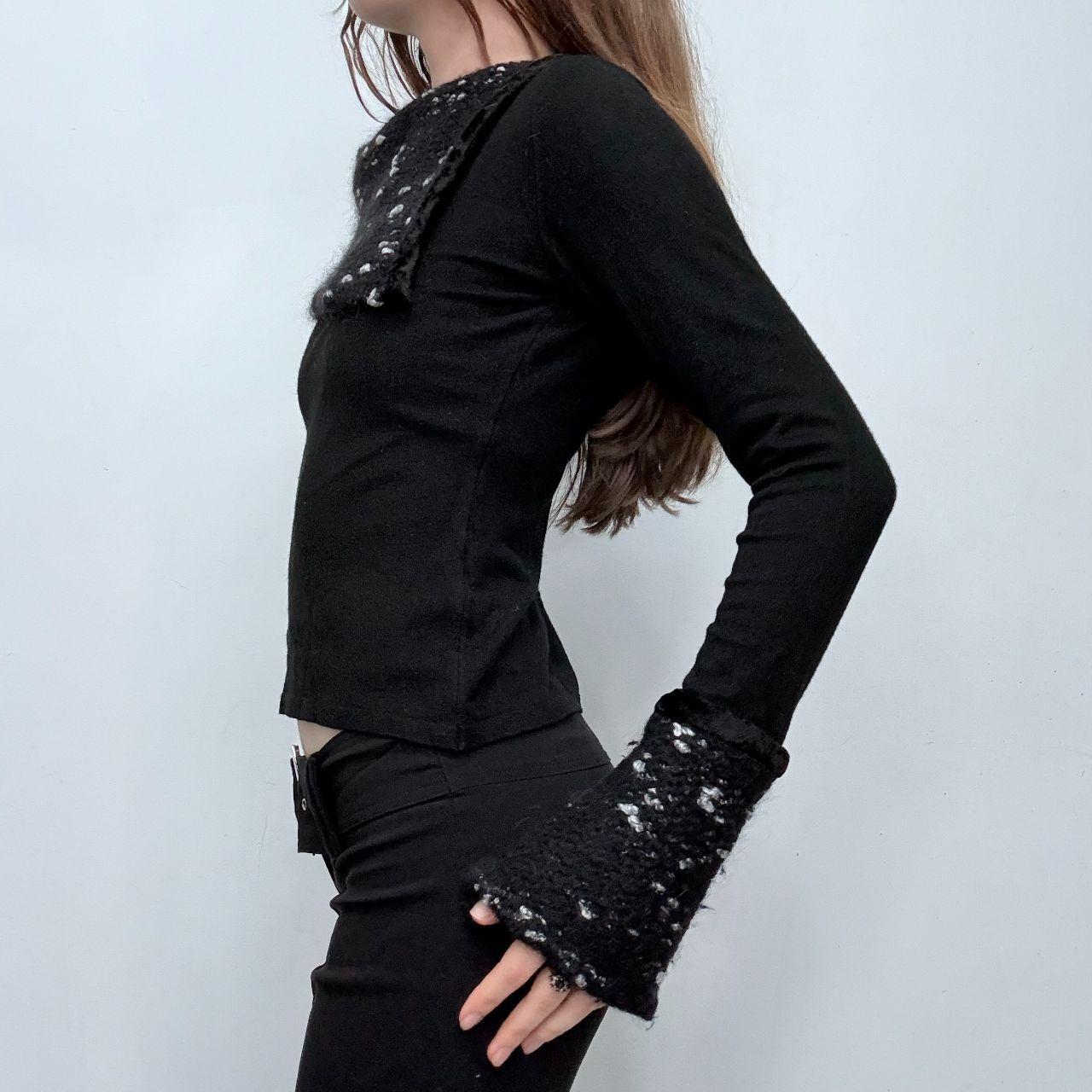 Black flared asymmetric knit top