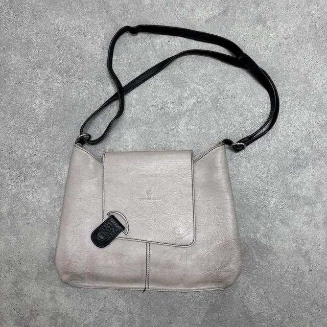 Asymmetrical leather cross-body bag
