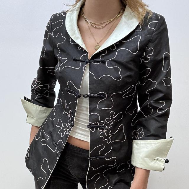 Flared emboidered silk jacket