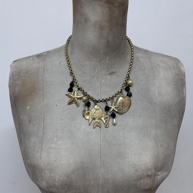 Gold sea shell mermaid charm necklace