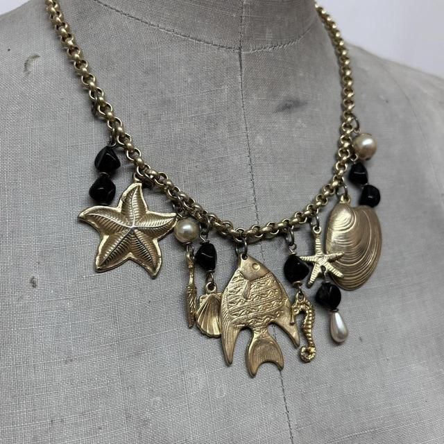 Gold sea shell mermaid charm necklace