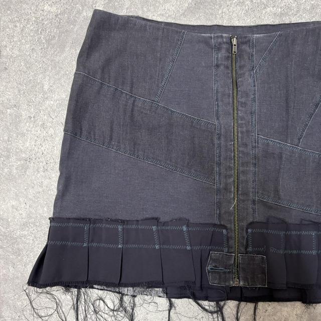 Distressed grunge pleated denim mini skirt
