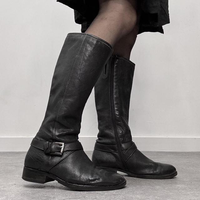 Black buckle riding boots