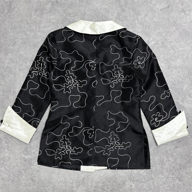 Flared emboidered silk jacket