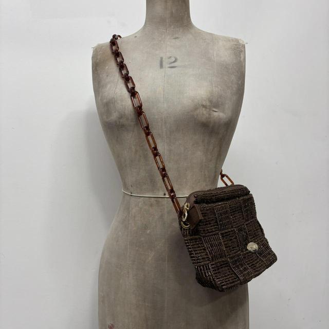 Brown woven crossbody bag