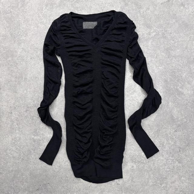 Black cinched long sleeve knit dress