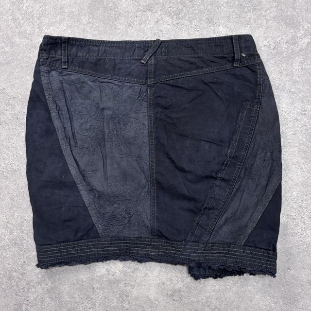 Distressed patchwork asymmetric skirt