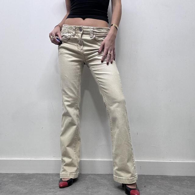 Cream flared distressed trousers