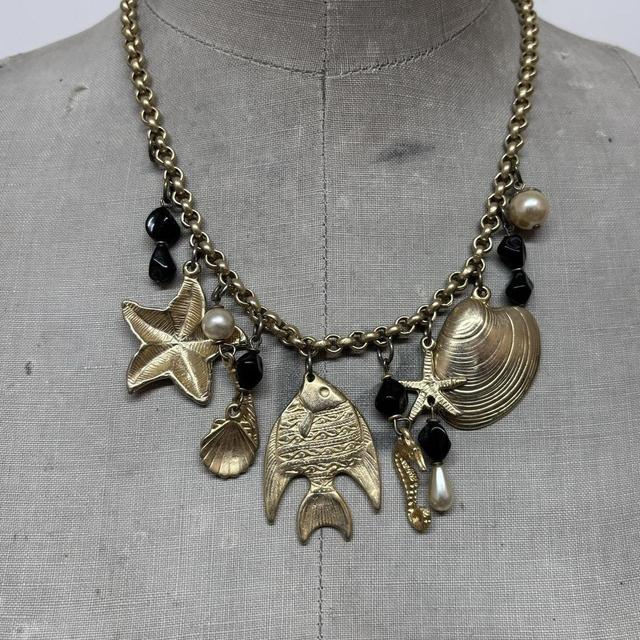 Gold sea shell mermaid charm necklace
