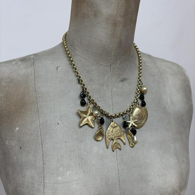 Gold sea shell mermaid charm necklace