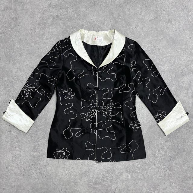 Flared emboidered silk jacket