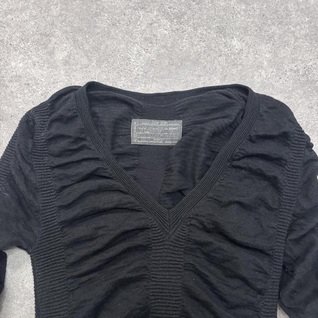 Black cinched long sleeve knit dress