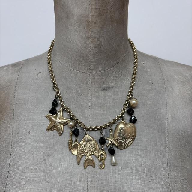 Gold sea shell mermaid charm necklace