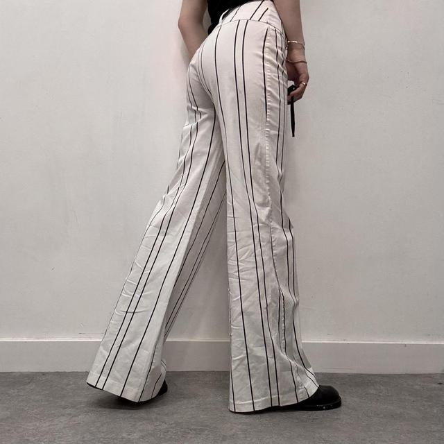 White pinstripe flared suit pants