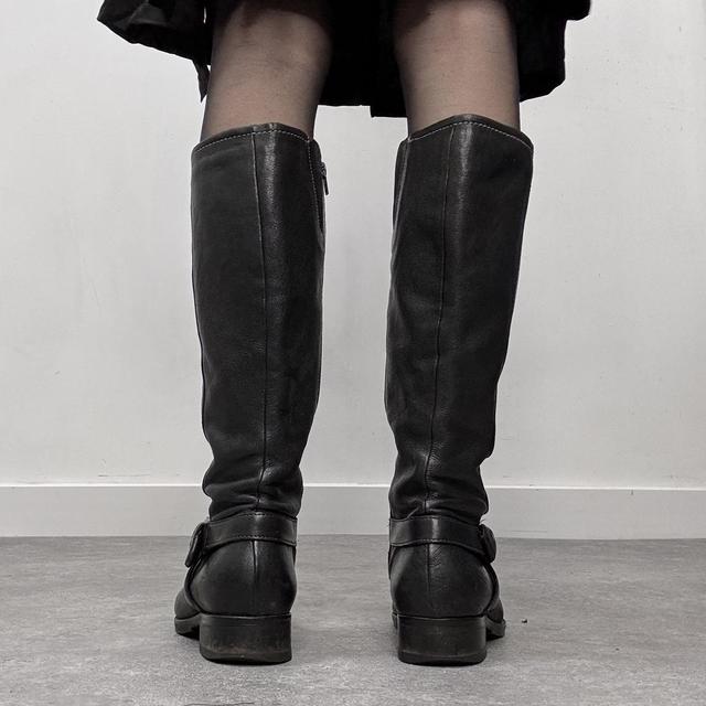 Black buckle riding boots