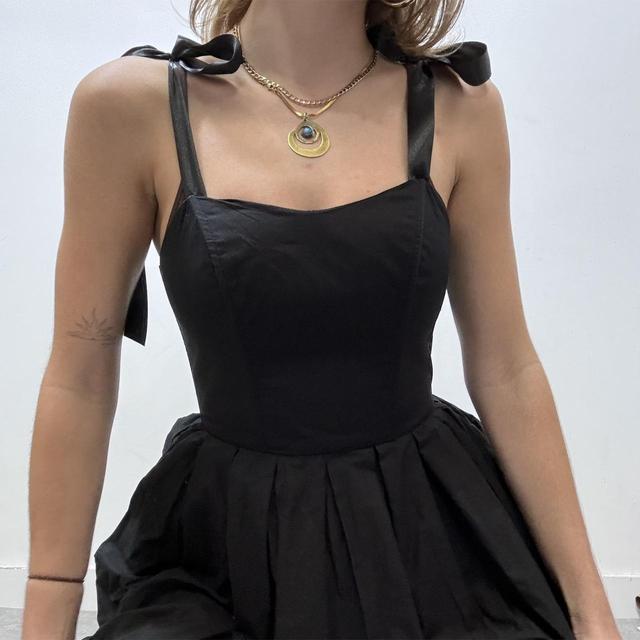 Black puff corset bow dress