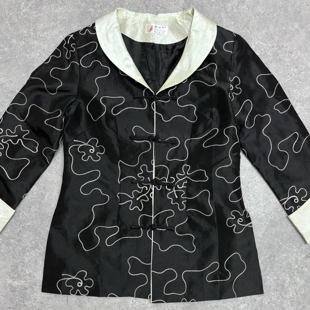 Flared emboidered silk jacket