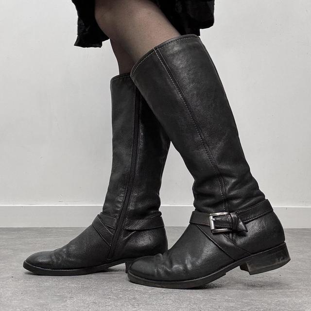 Black buckle riding boots